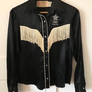 Vintage western fringed shirt with snap closures.